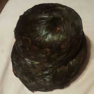 A pillbox feathered jillie hat from the 1940s